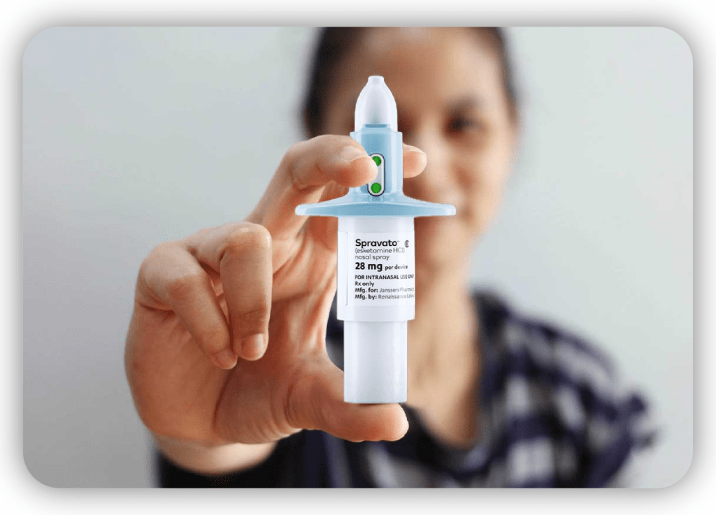 A person holding a Spravato nasal spray for depression treatment, focusing on innovative medical solutions